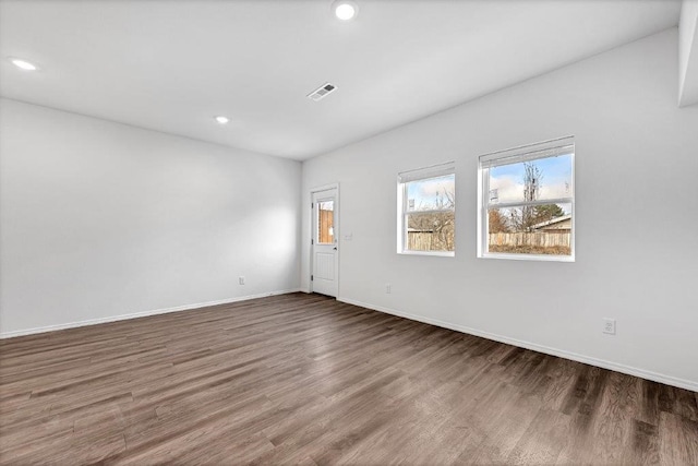 empty room featuring hardwood / wood-style flooring