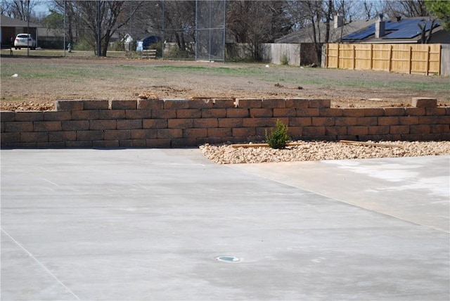 view of patio featuring fence