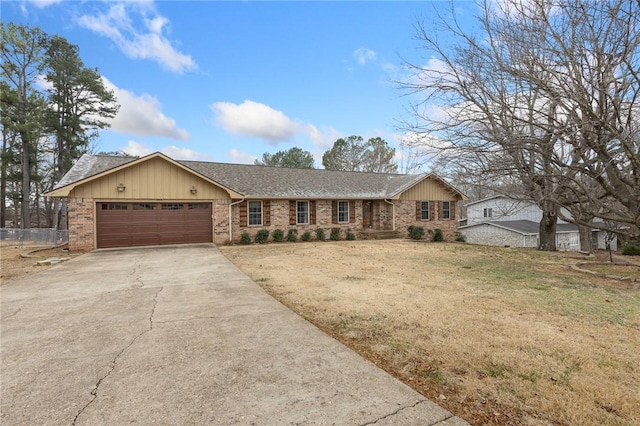 ranch-style home with a garage and a front lawn