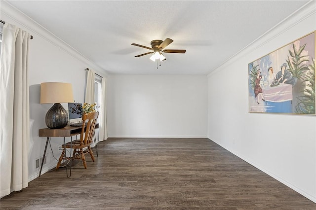 office space featuring dark wood-type flooring, ceiling fan, and ornamental molding