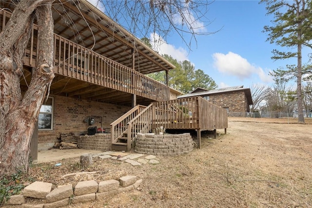 view of property exterior with a deck