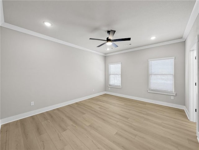 empty room with ceiling fan, light hardwood / wood-style floors, and crown molding