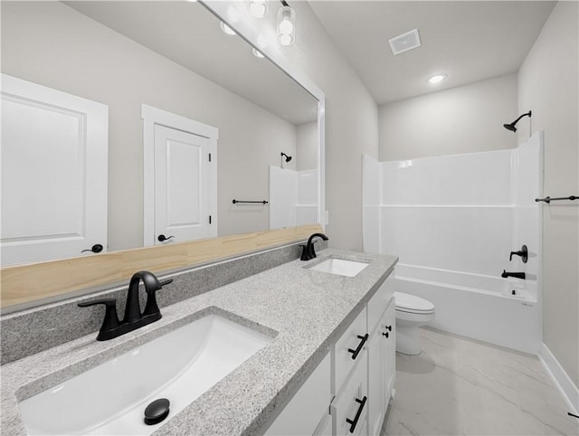 full bathroom featuring shower / bathing tub combination, vanity, and toilet