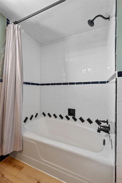 bathroom featuring shower / bath combination with curtain and wood-type flooring