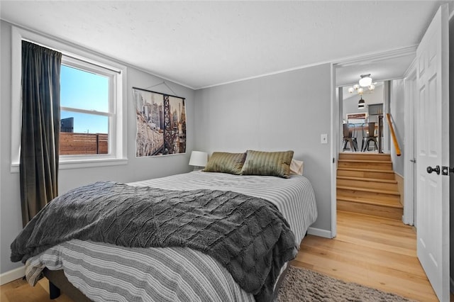 bedroom with hardwood / wood-style floors