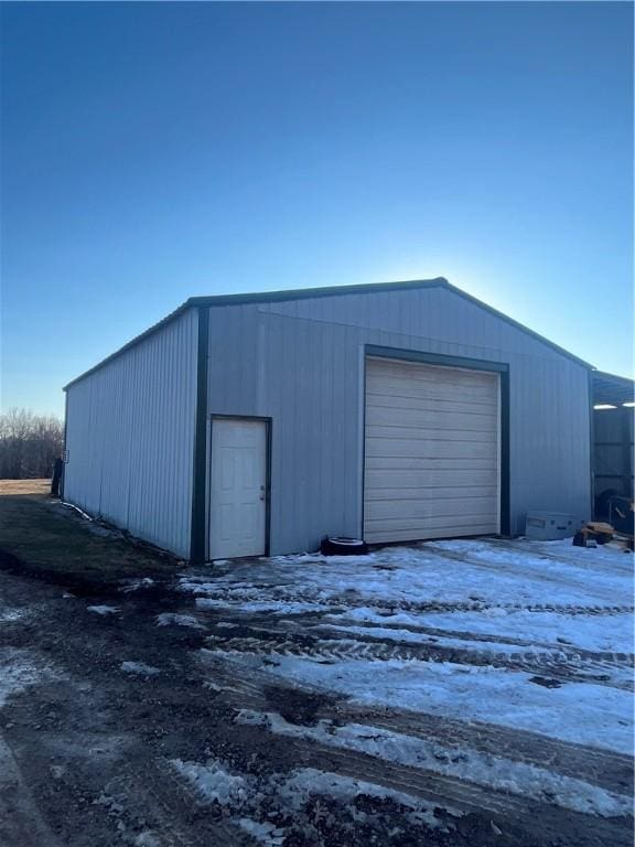 view of snow covered garage