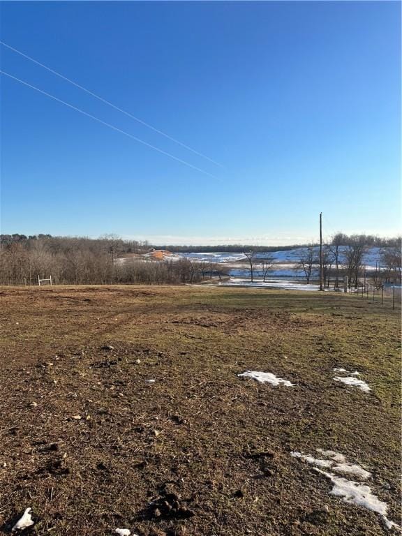 view of yard featuring a rural view and a water view