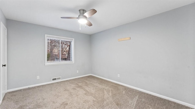 carpeted empty room featuring ceiling fan