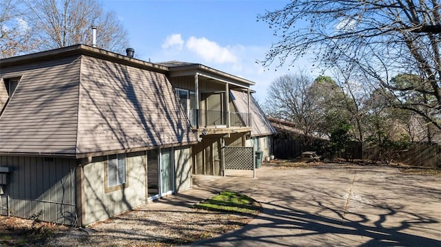 view of side of property with a patio