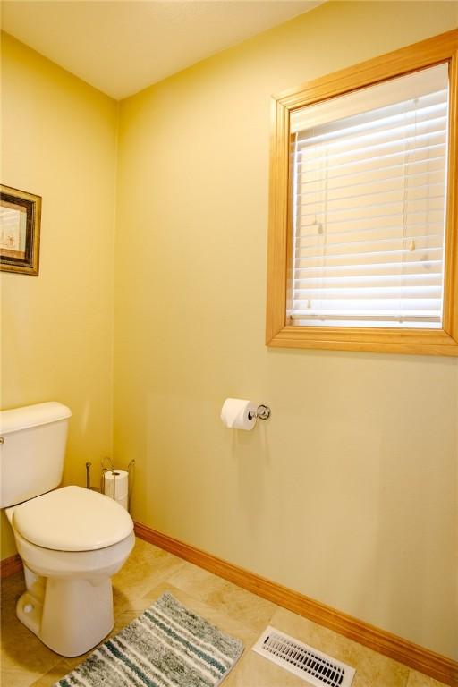 bathroom with tile patterned floors and toilet