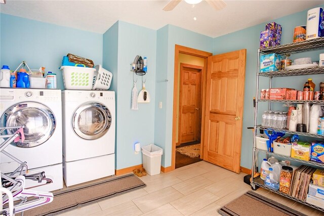 clothes washing area featuring washing machine and clothes dryer and ceiling fan