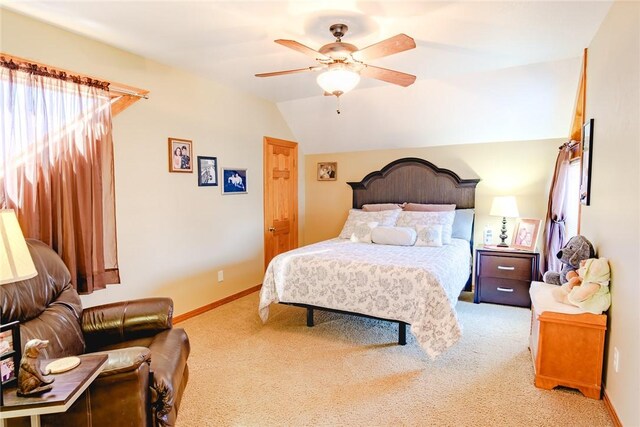 carpeted bedroom featuring vaulted ceiling and ceiling fan