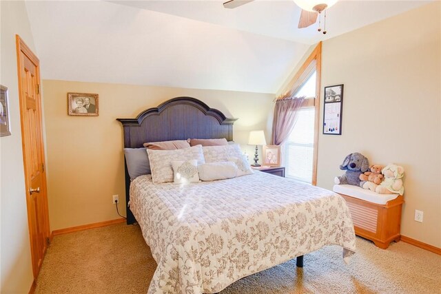 bedroom featuring vaulted ceiling, ceiling fan, and light carpet