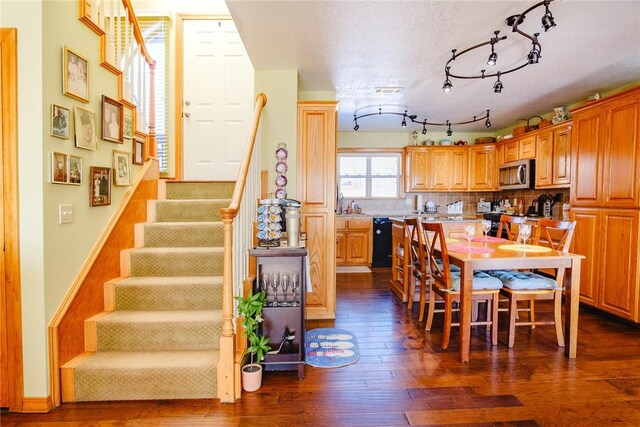 dining area featuring dark hardwood / wood-style floors