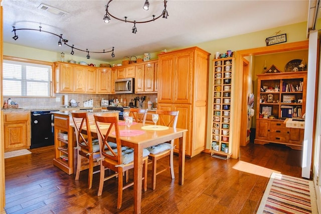 dining area featuring dark hardwood / wood-style flooring