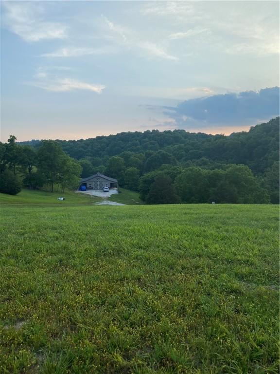 property view of mountains featuring a rural view