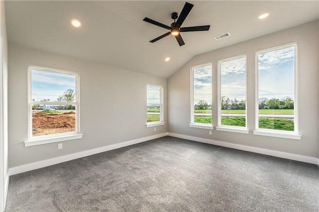 unfurnished room featuring ceiling fan, vaulted ceiling, and carpet floors