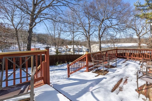 view of snow covered deck