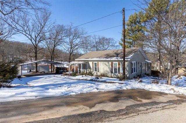 view of front of home with a carport