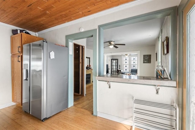 kitchen featuring stainless steel refrigerator with ice dispenser, radiator, wooden ceiling, and light wood-type flooring