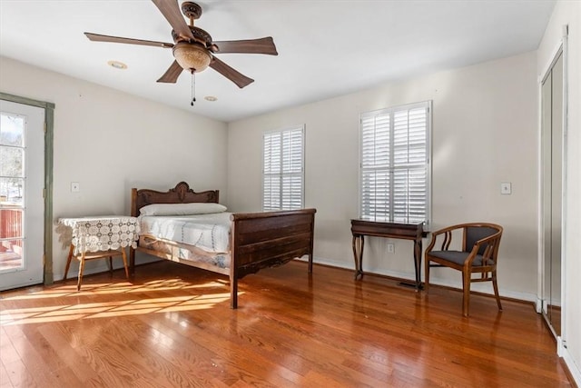 bedroom featuring ceiling fan and hardwood / wood-style flooring