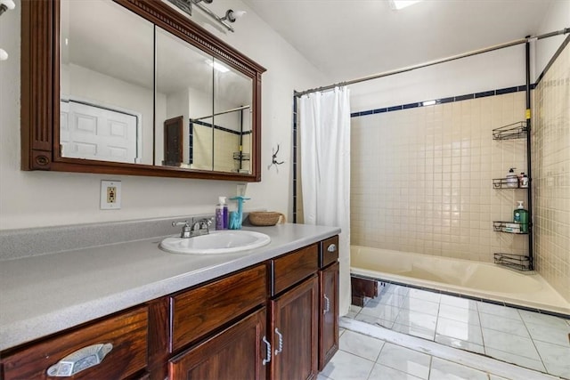 bathroom featuring vanity, tile patterned floors, and shower / bath combo