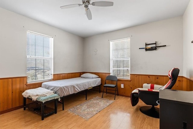 bedroom with ceiling fan and light hardwood / wood-style flooring