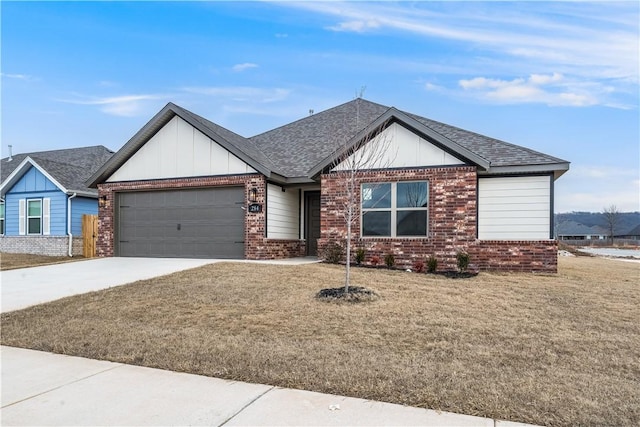 view of front of home with a front yard and a garage