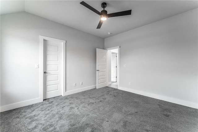 spare room featuring ceiling fan, vaulted ceiling, and carpet flooring