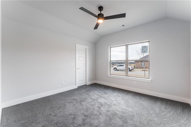 carpeted spare room with lofted ceiling and ceiling fan