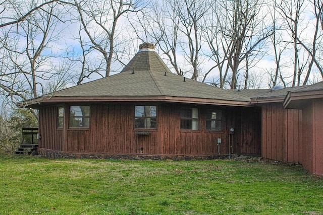 view of side of property with a yard