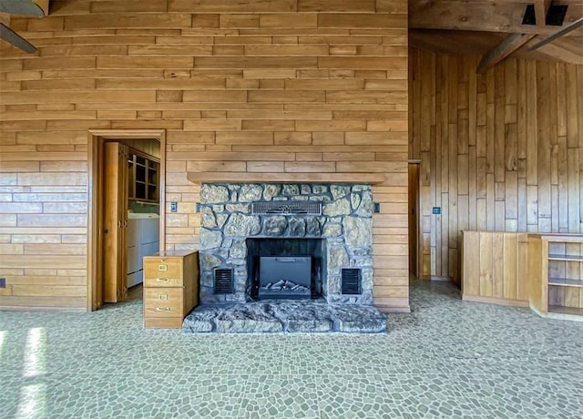 interior details featuring wooden walls and a fireplace