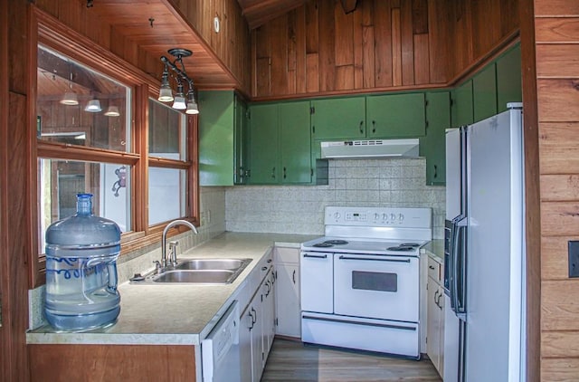 kitchen featuring sink, white appliances, and dark hardwood / wood-style floors