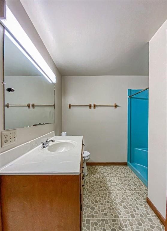 bathroom featuring toilet and vanity