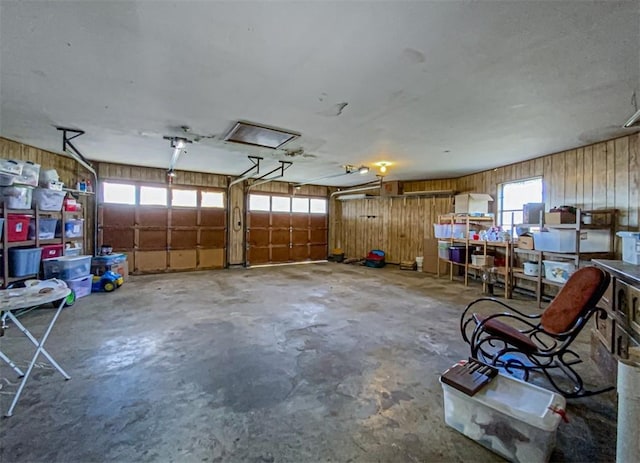 garage featuring wooden walls