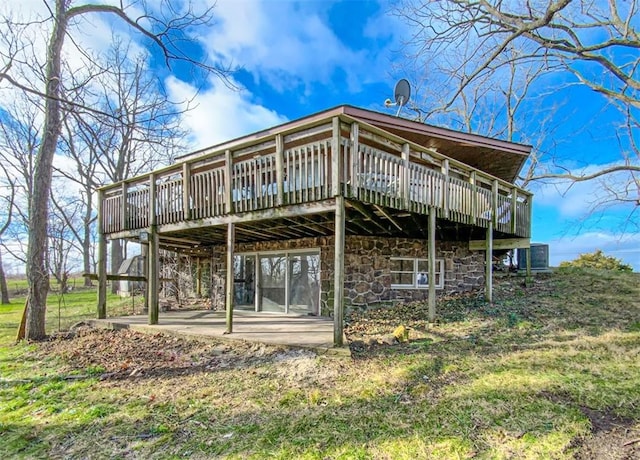 rear view of property with a patio area and a wooden deck