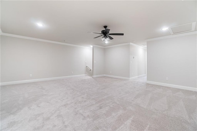 unfurnished room featuring ceiling fan, crown molding, and light carpet