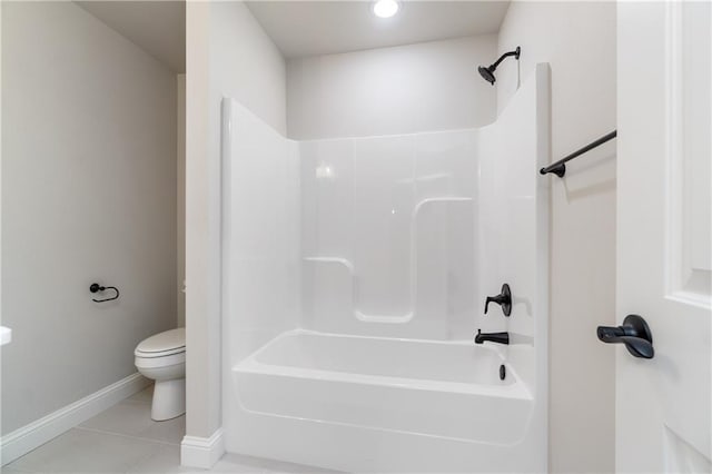 bathroom with toilet, shower / bath combination, and tile patterned floors