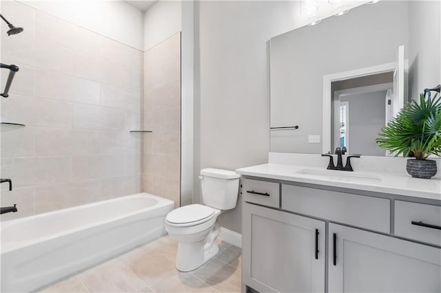 full bathroom featuring toilet, vanity, and tiled shower / bath