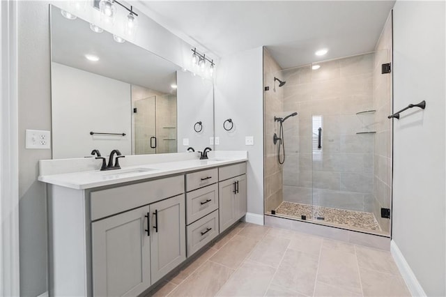 bathroom featuring vanity, tile patterned floors, and walk in shower