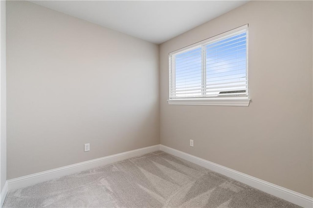 unfurnished room with light colored carpet