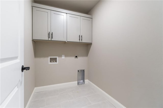 clothes washing area with electric dryer hookup, hookup for a washing machine, cabinets, and light tile patterned floors