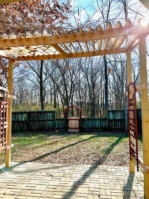 view of patio with a pergola and a playground