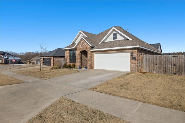 view of front facade with a front yard and a garage