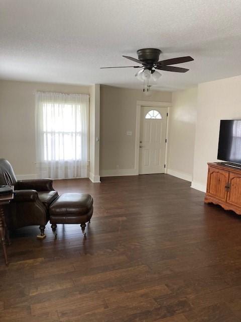 foyer with dark wood-type flooring and ceiling fan