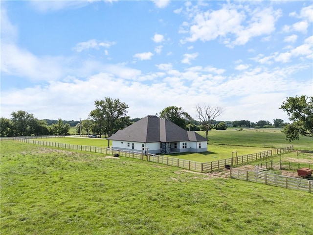 view of yard with a rural view