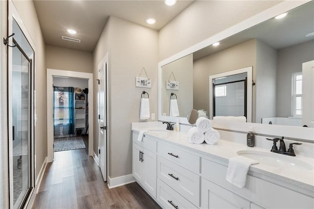 bathroom featuring hardwood / wood-style floors and vanity