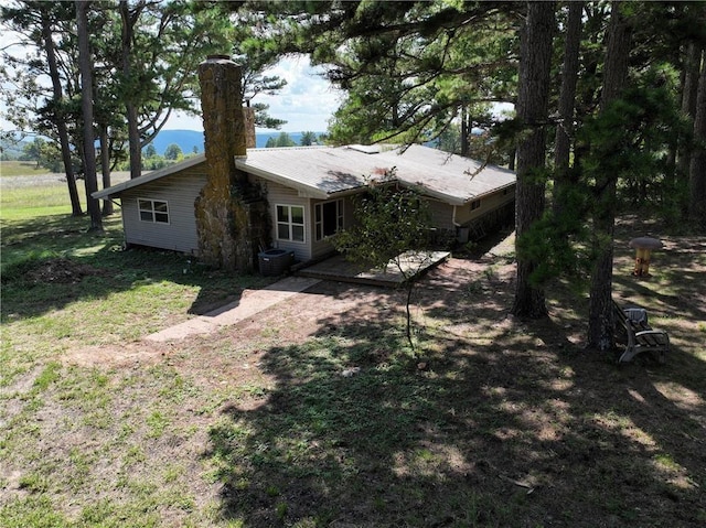 rear view of house with cooling unit