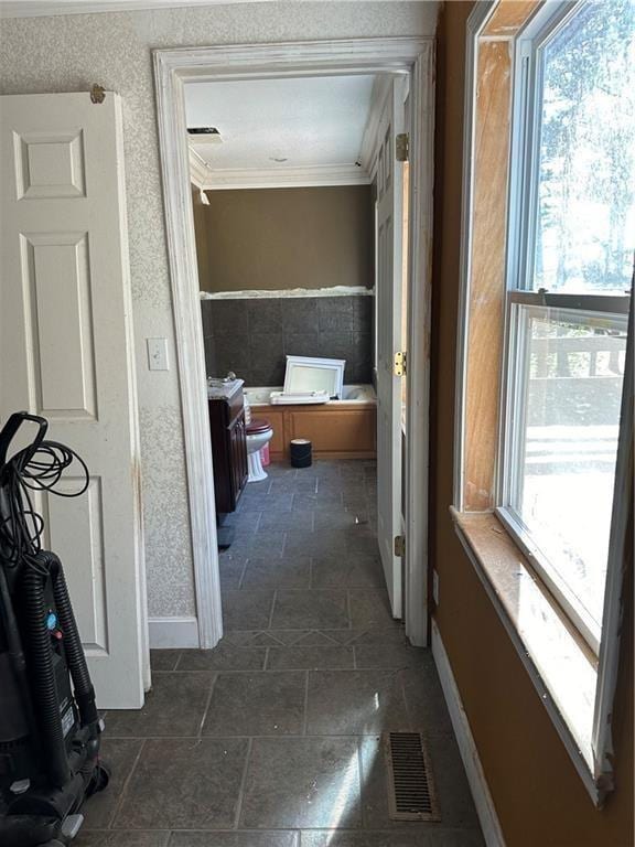 hallway with crown molding