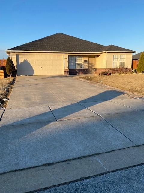 single story home with a garage